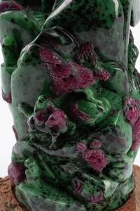 A Chinese Carved Ruby Zoisite Boulder on a Wood Base