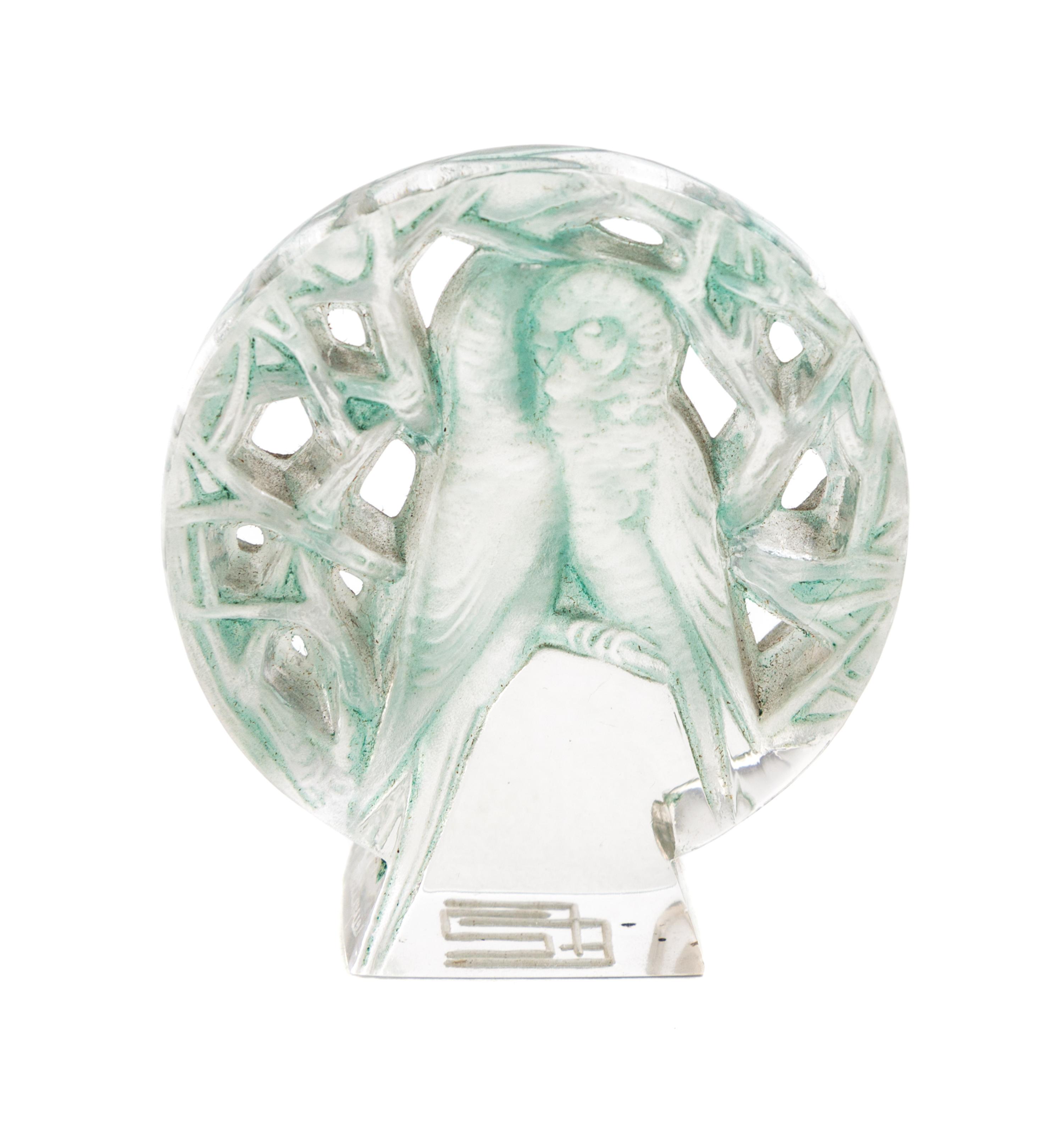 A Rene Lalique Molded and Frosted Glass Seal Height 2 inches.