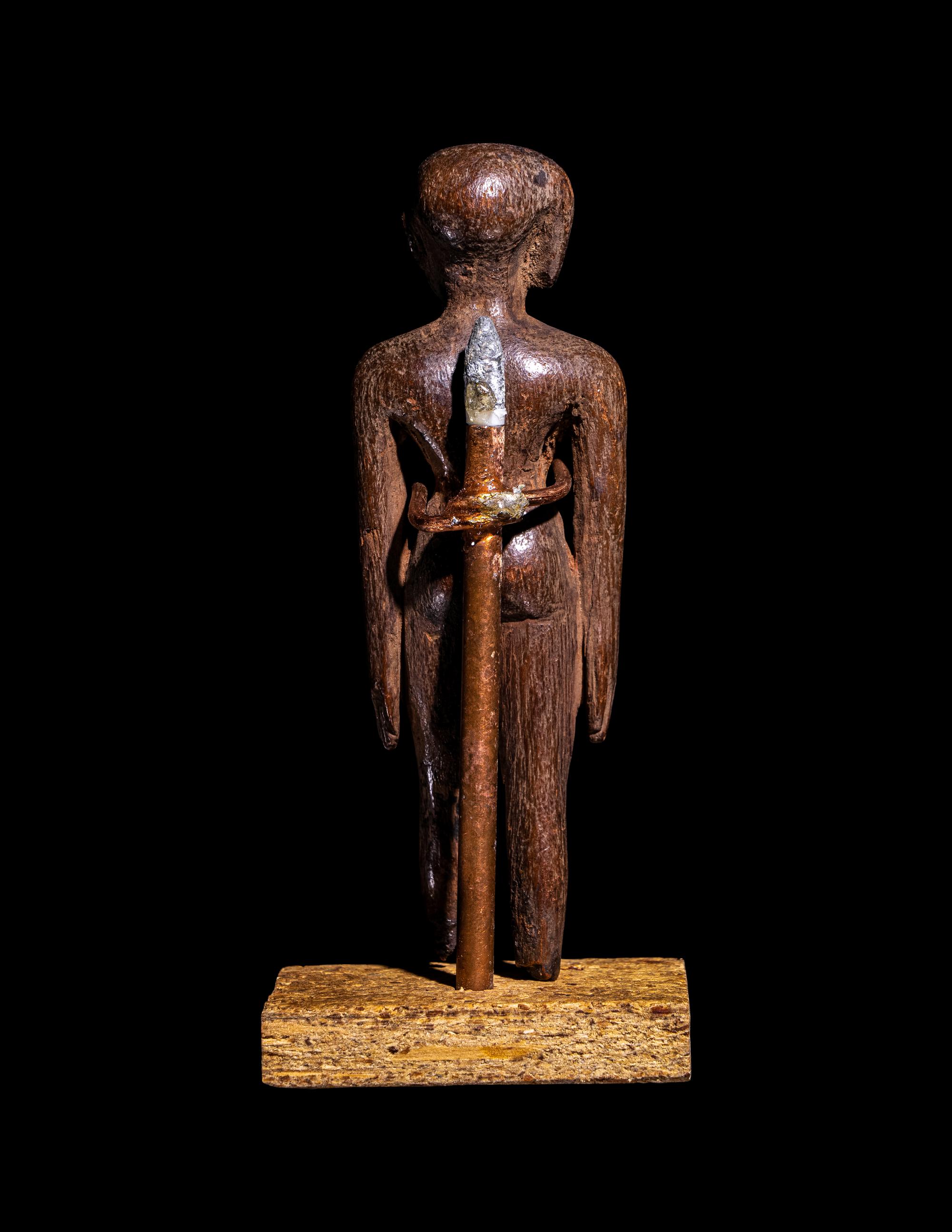An Egyptian Wood Figure of a Youth