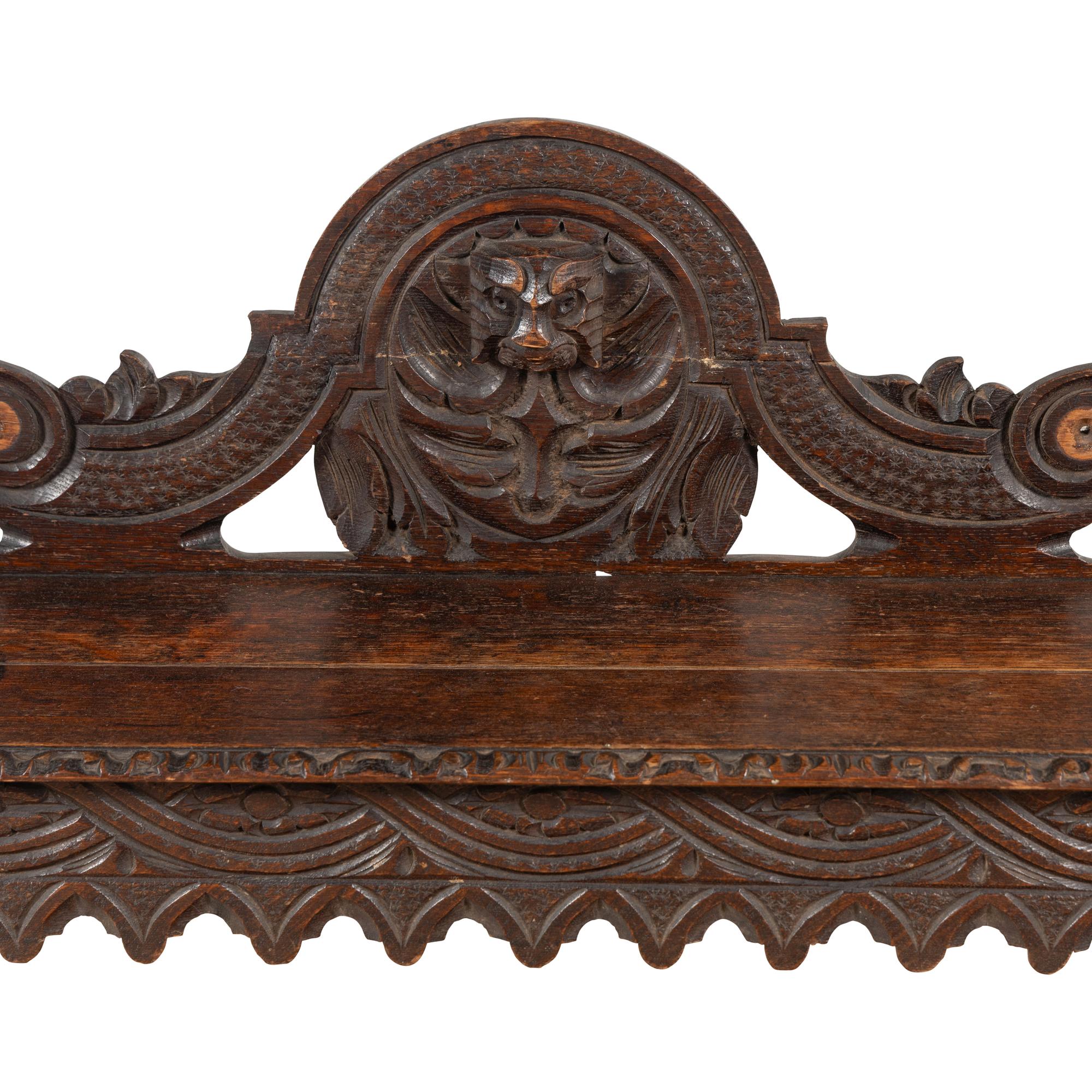 An Italian Carved Oak Hall Bench