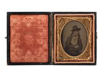 [WESTERN AMERICANA]. Ninth plate tintype of cowgirl “Annie." Ca 1870.