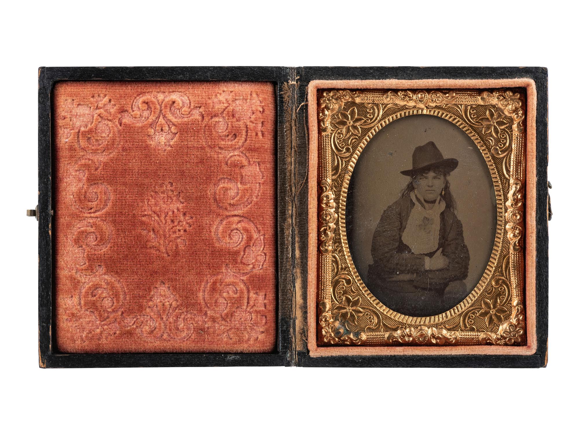[WESTERN AMERICANA]. Ninth plate tintype of cowgirl “Annie." Ca 1870.