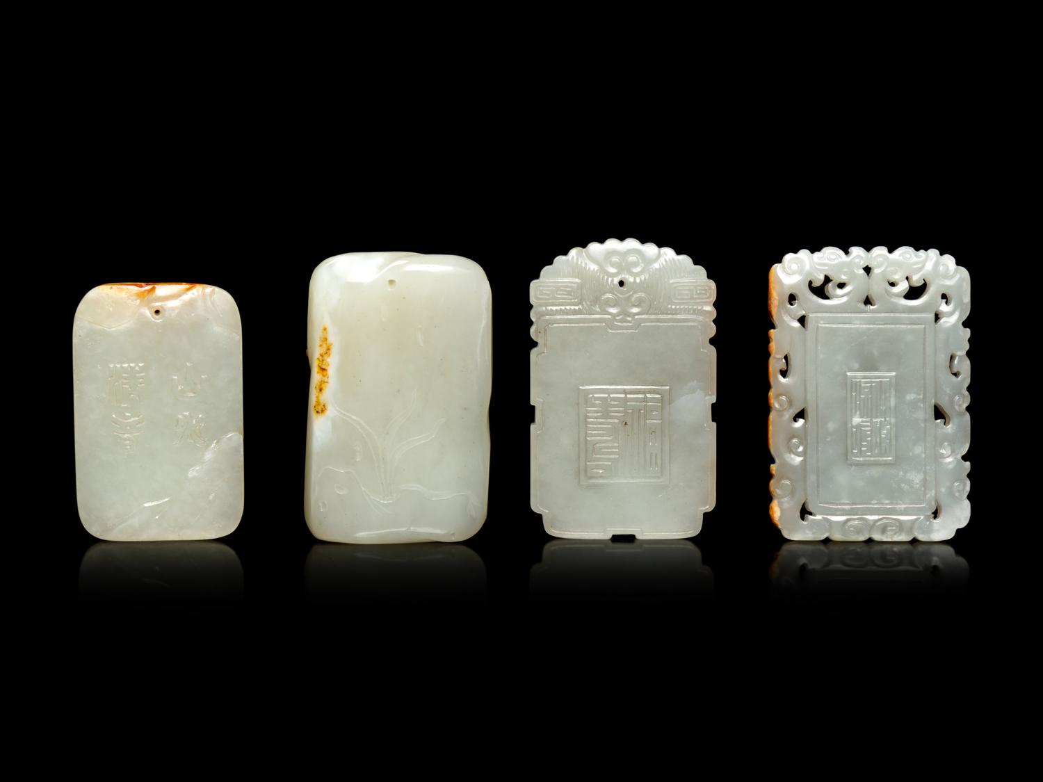 Four White and Russet Jade Plaques