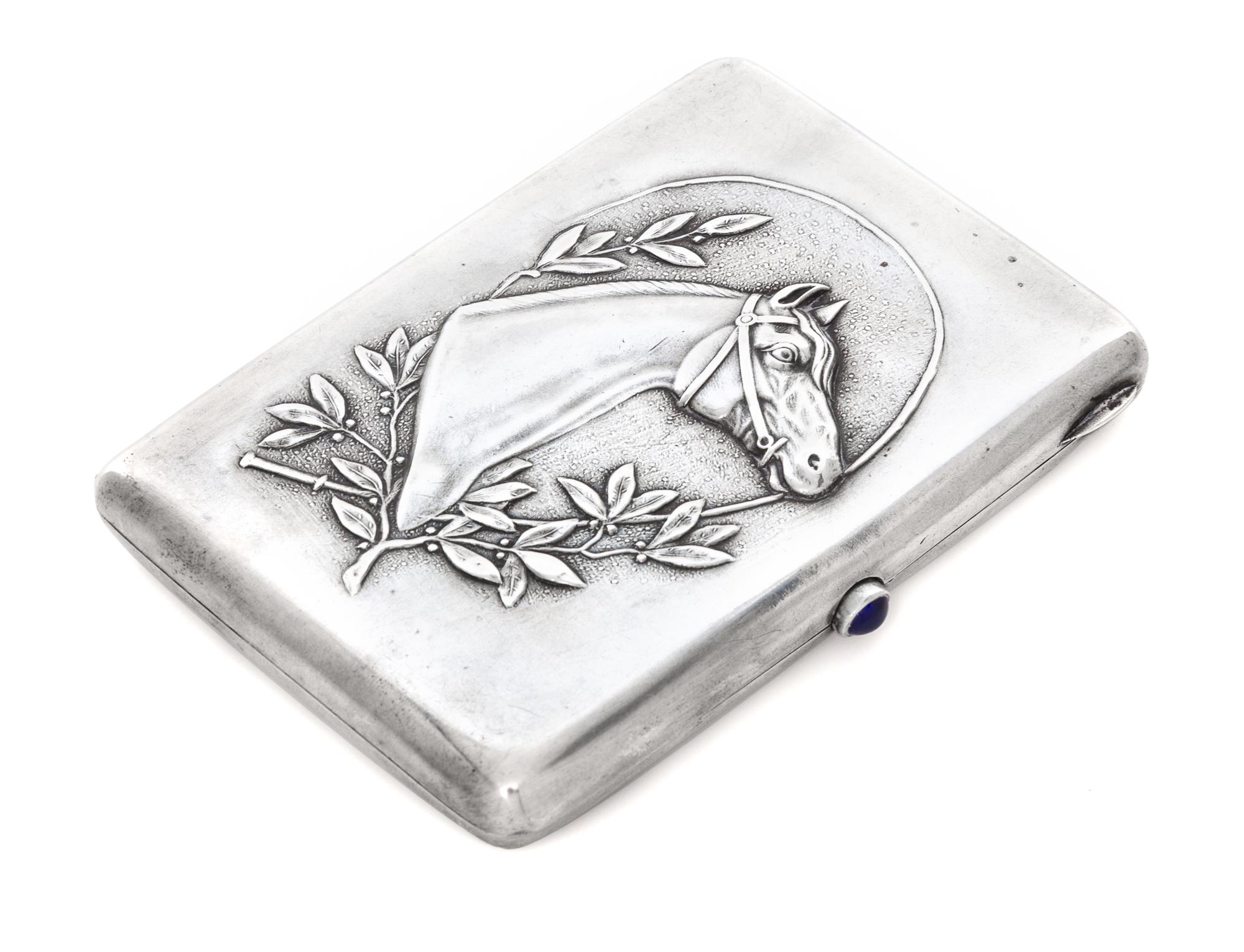 A Russian Silver Cigarette Case, Maker's mark Cyrillic DS, Moscow, the case worked to show the profile of a throughbred horse bordered