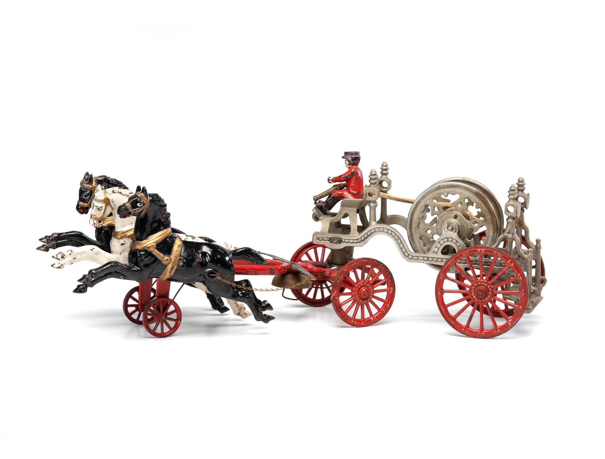 A Painted Cast-Iron Three-Horse Toy Fire Engine