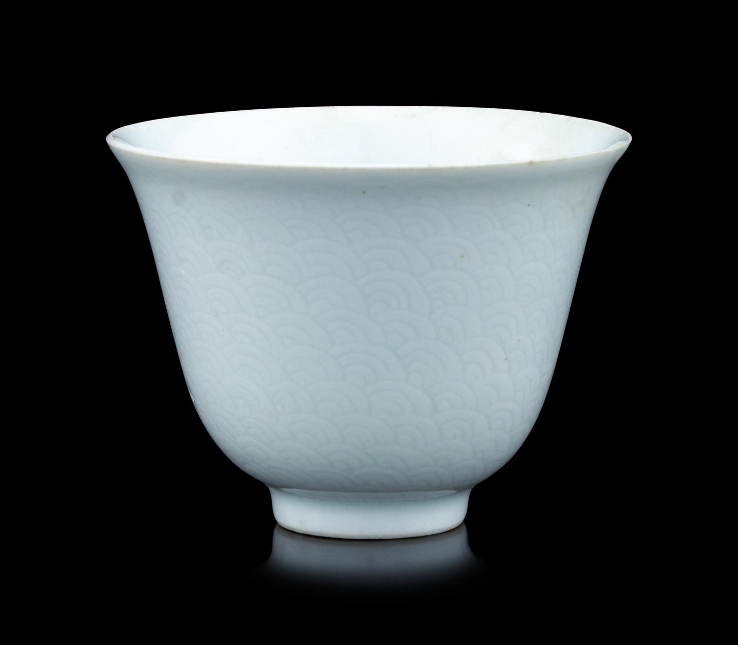 A Chinese Incised White Glazed Porcelain 'Waves' Cup