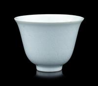 A Chinese Incised White Glazed Porcelain 'Waves' Cup