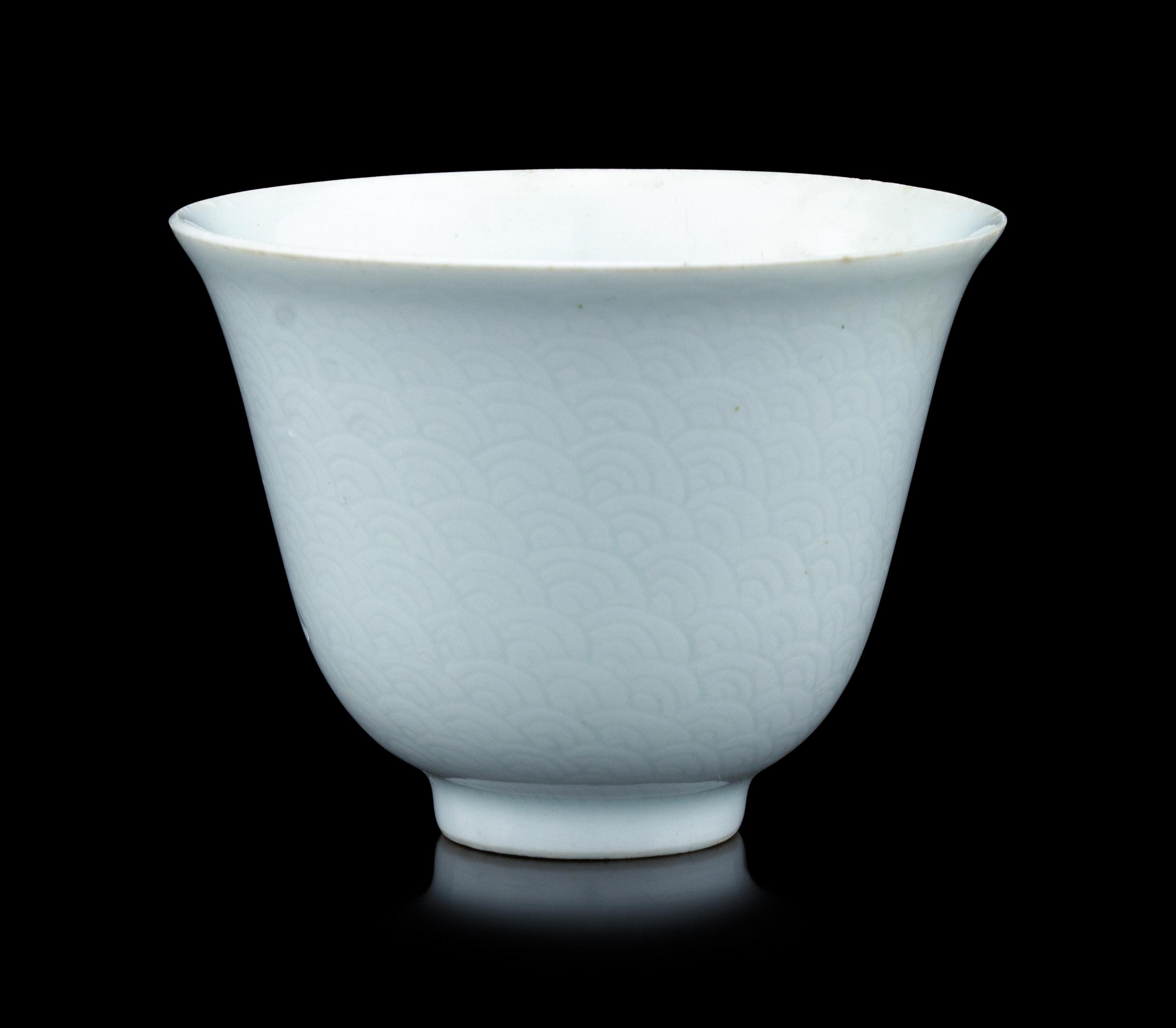 A Chinese Incised White Glazed Porcelain 'Waves' Cup