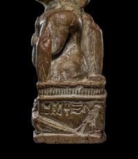 An Egyptian Glazed Steatite Amulet of Pataikos on Crocodiles