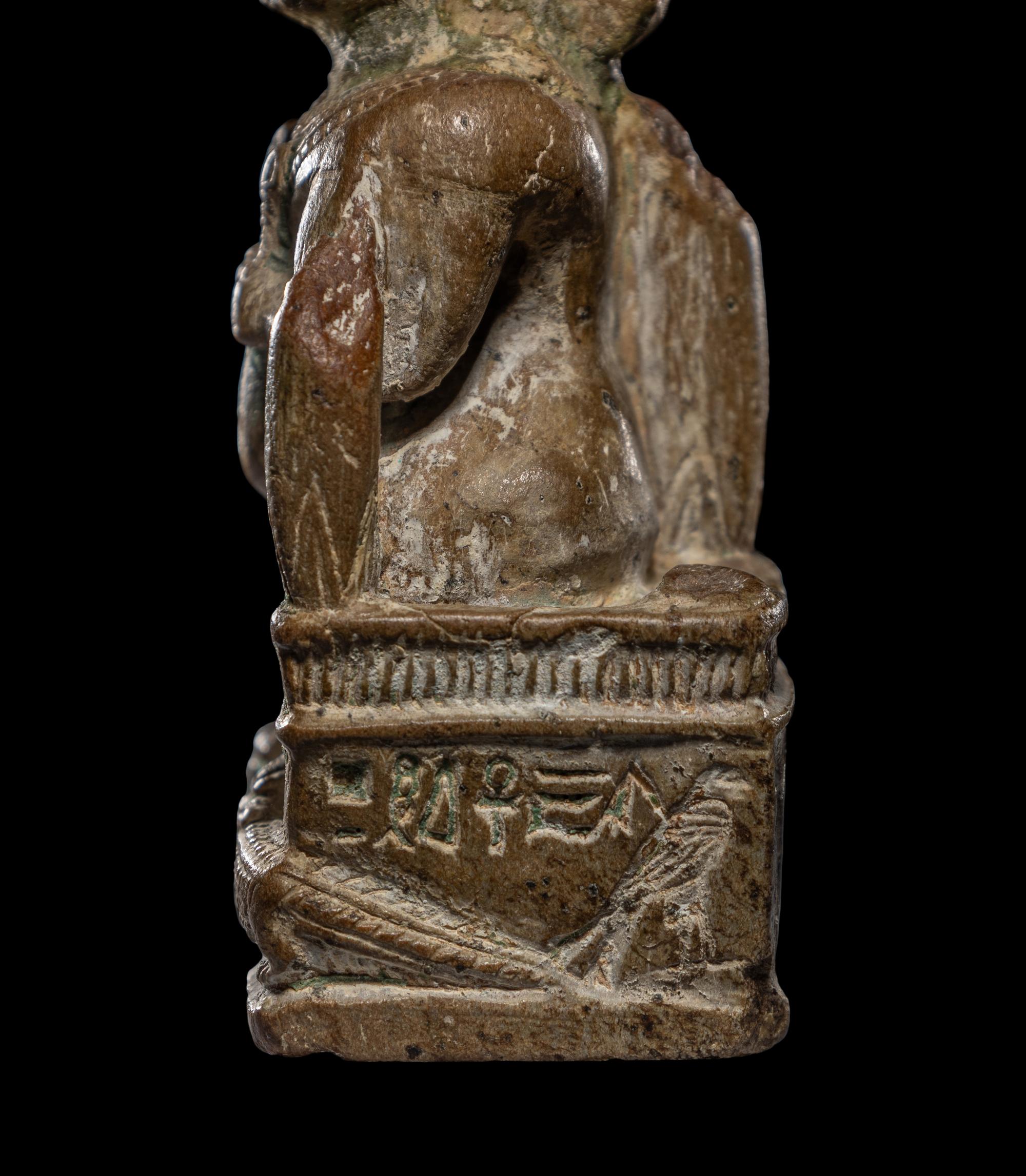 An Egyptian Glazed Steatite Amulet of Pataikos on Crocodiles
