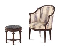A Louis XVI Style Carved Walnut Bergère and Side Table