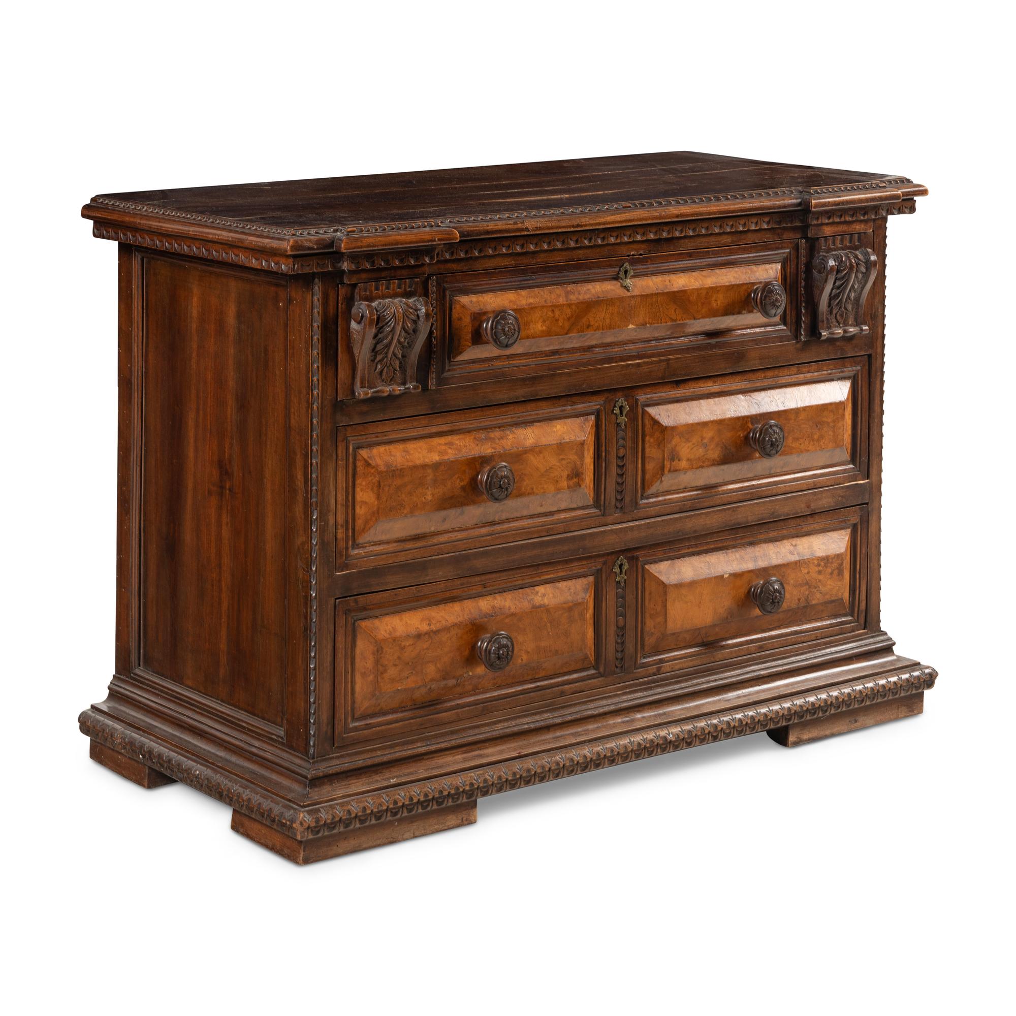 An Italian Carved Walnut Chest of Drawers