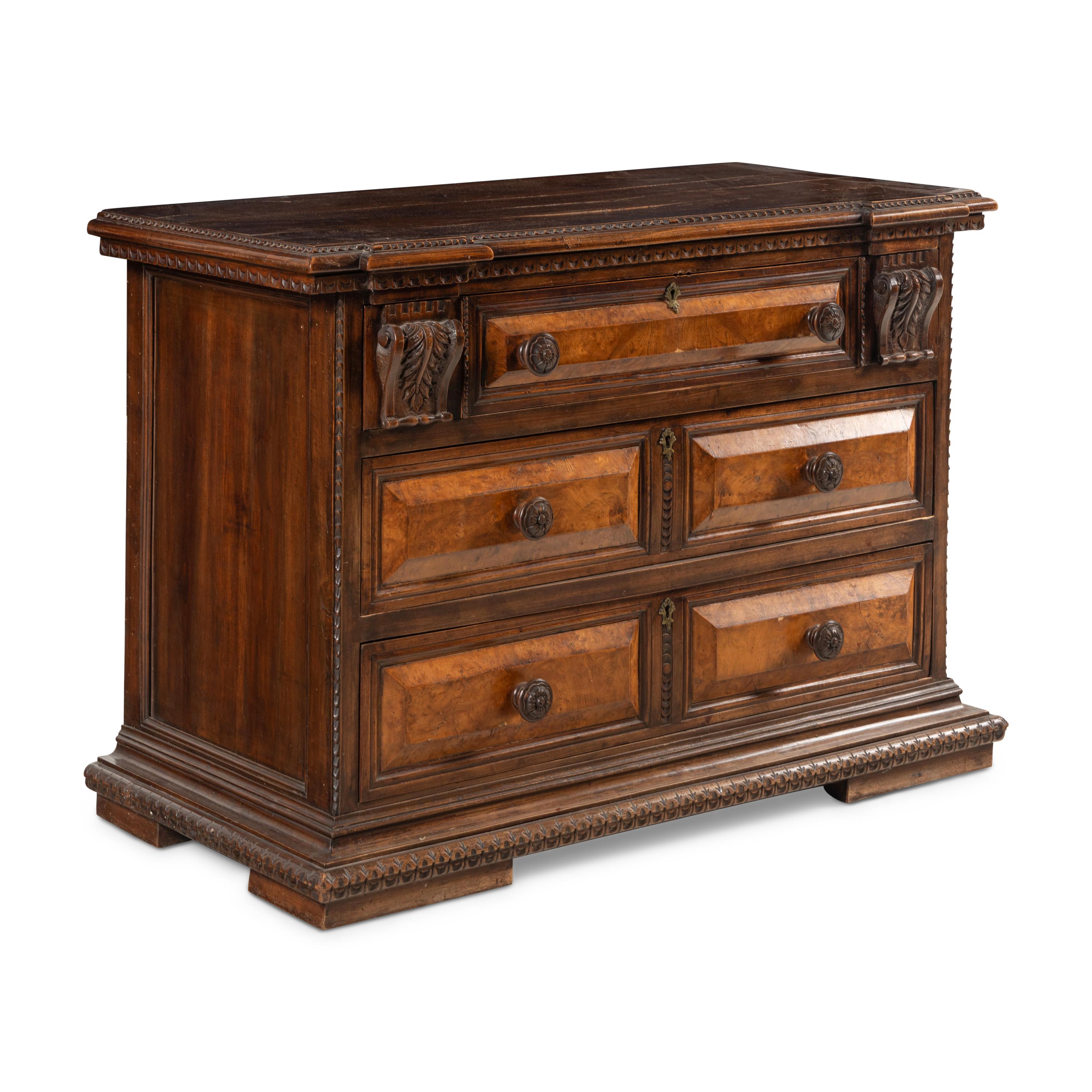 An Italian Carved Walnut Chest of Drawers