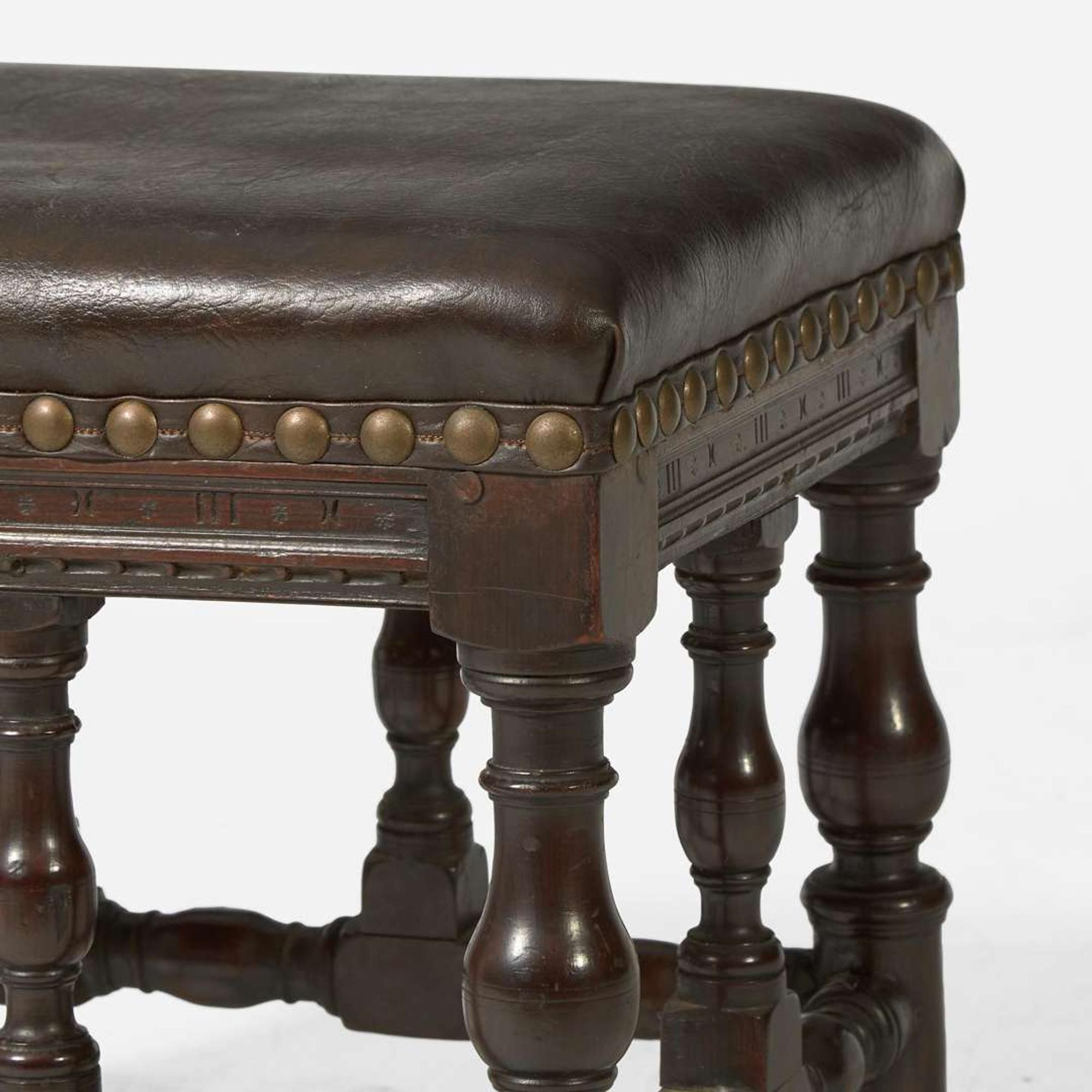 A pair of Baroque Revival carved walnut stools late 19th / early 20th century, possibly incorporating earlier elements