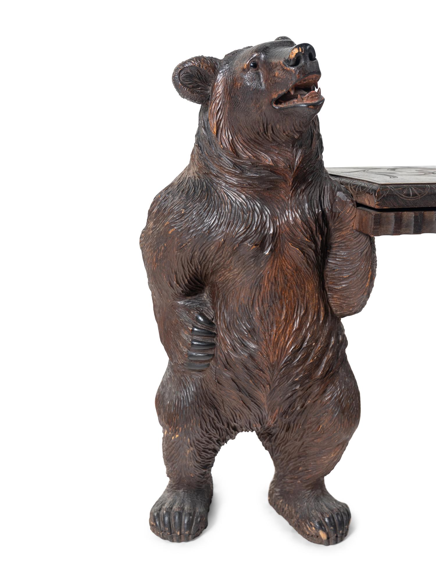A Black Forest Carved Figural Hall Bench