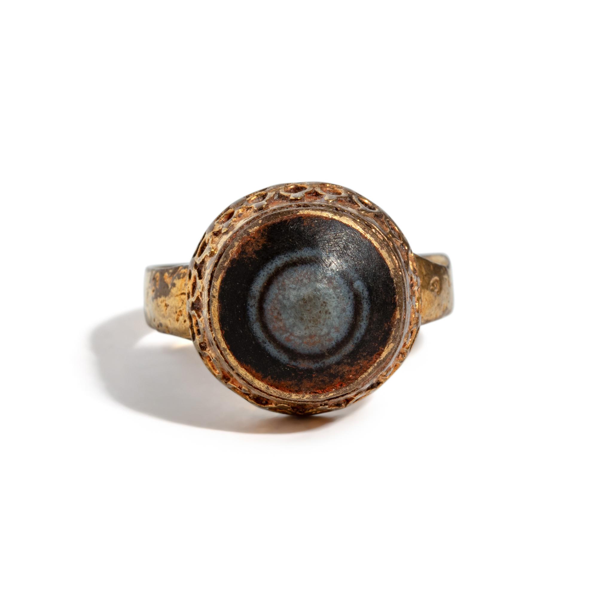 A Near Eastern Banded Agate Cabochon — Set in a gold ring
