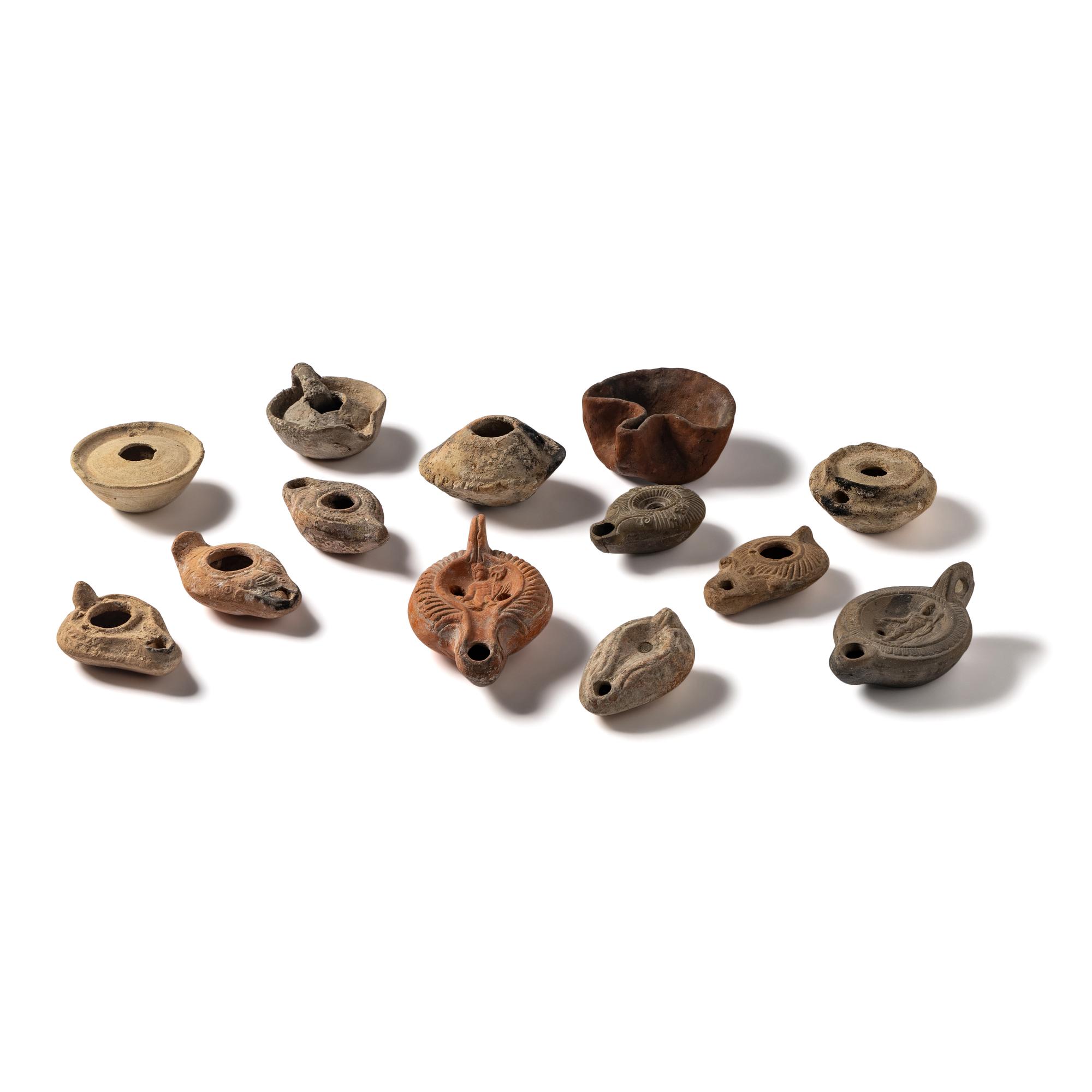 Thirteen Roman and Holy Land Terracotta Lamps