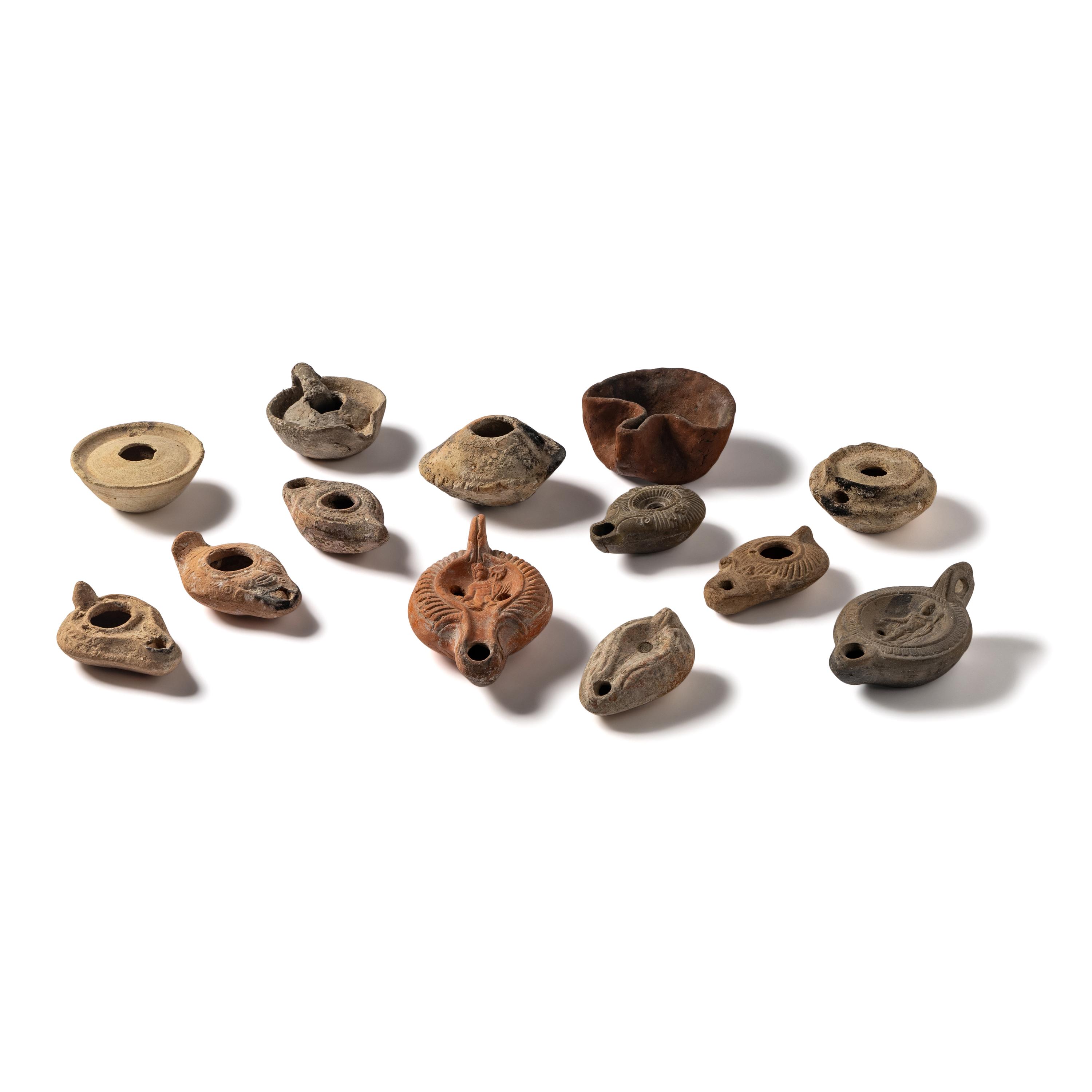 Thirteen Roman and Holy Land Terracotta Lamps