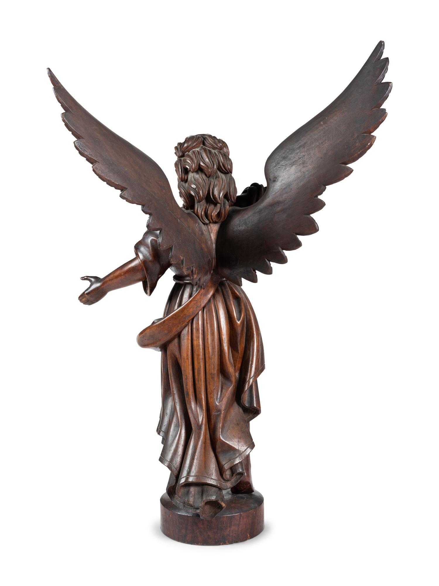 A Carved Walnut Figure of Angel Gabriel