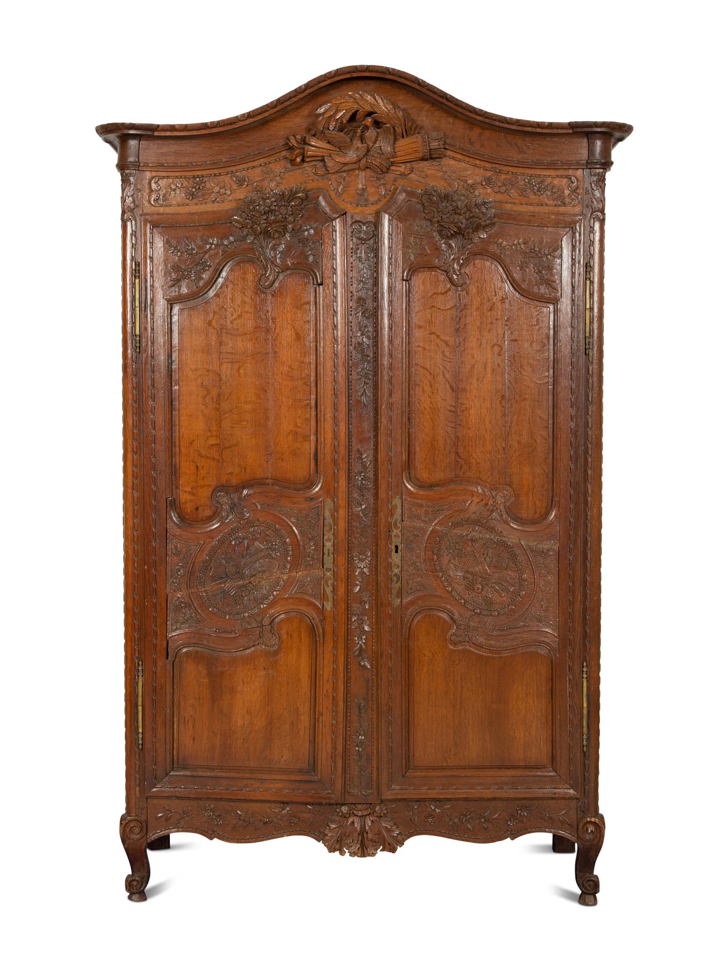 A French Provincial Carved Oak Armoire