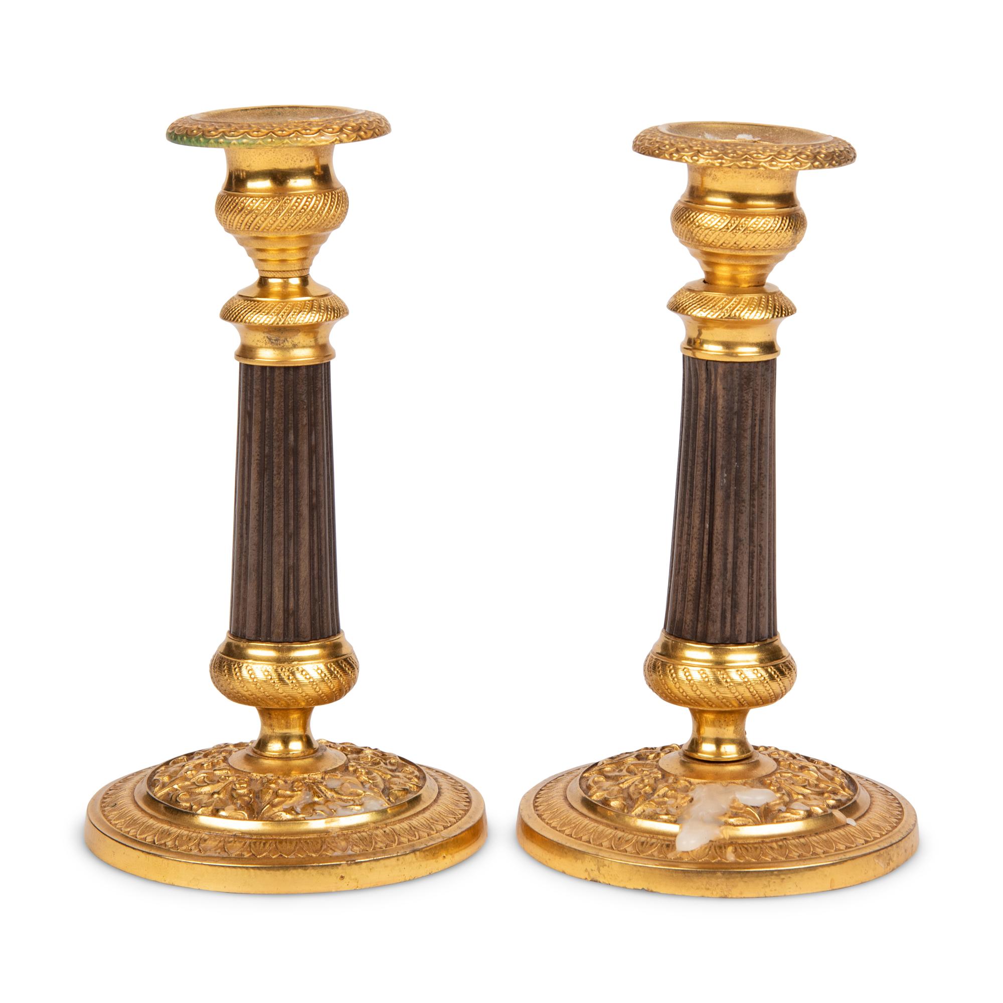A Pair of Gilt Metal Mounted Candlesticks