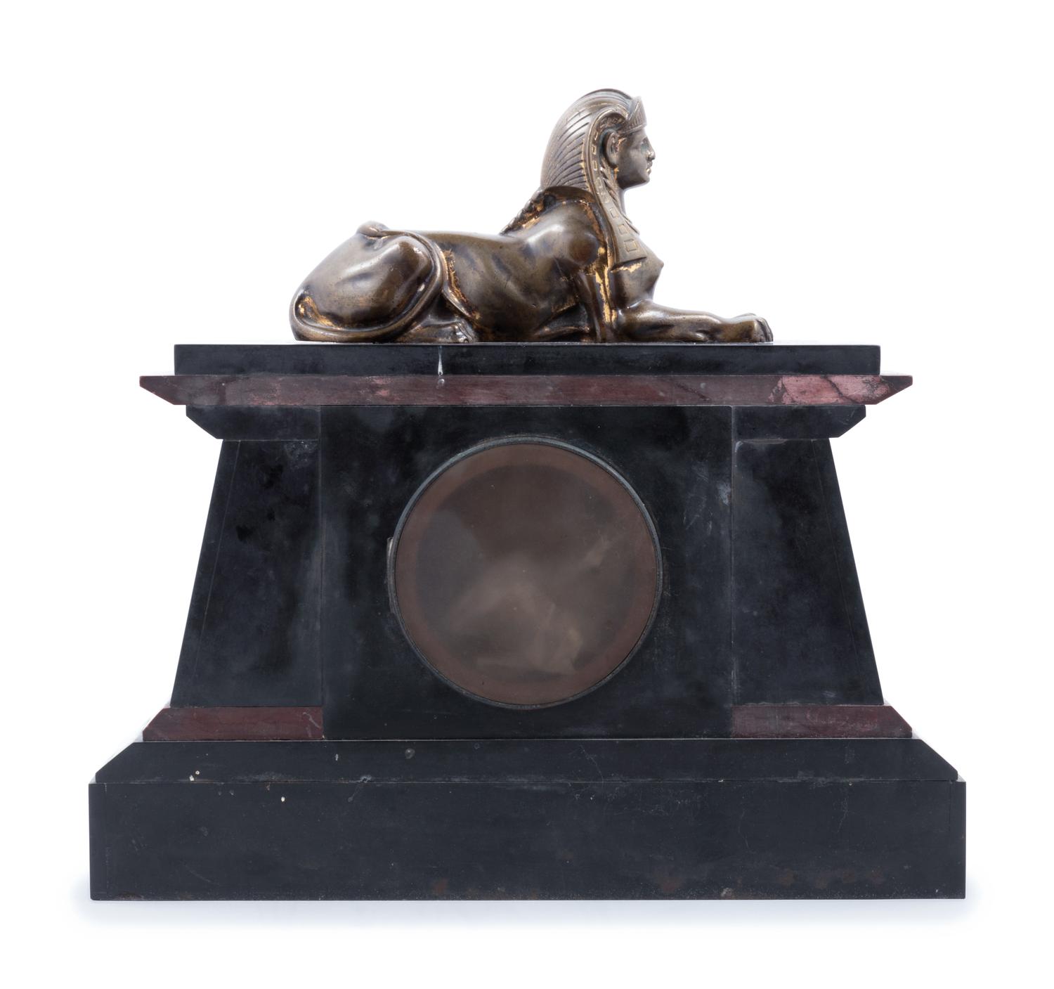 An Egyptian Revival Bronze Mounted and Parcel Gilt Mantel Clock