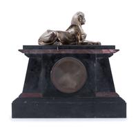 An Egyptian Revival Bronze Mounted and Parcel Gilt Mantel Clock
