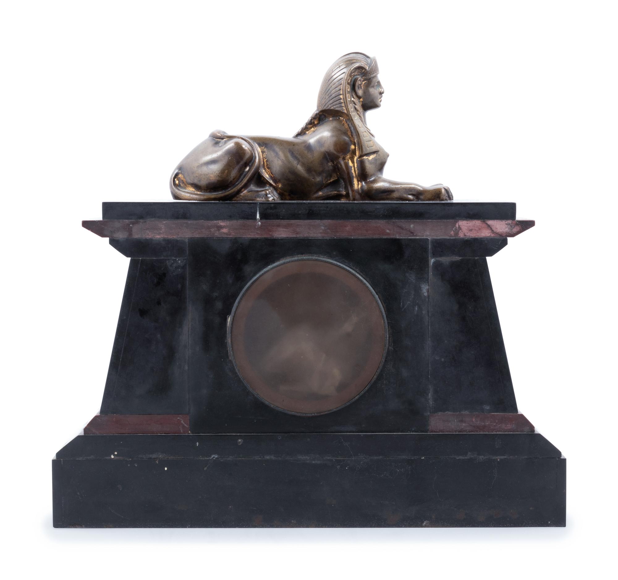 An Egyptian Revival Bronze Mounted and Parcel Gilt Mantel Clock