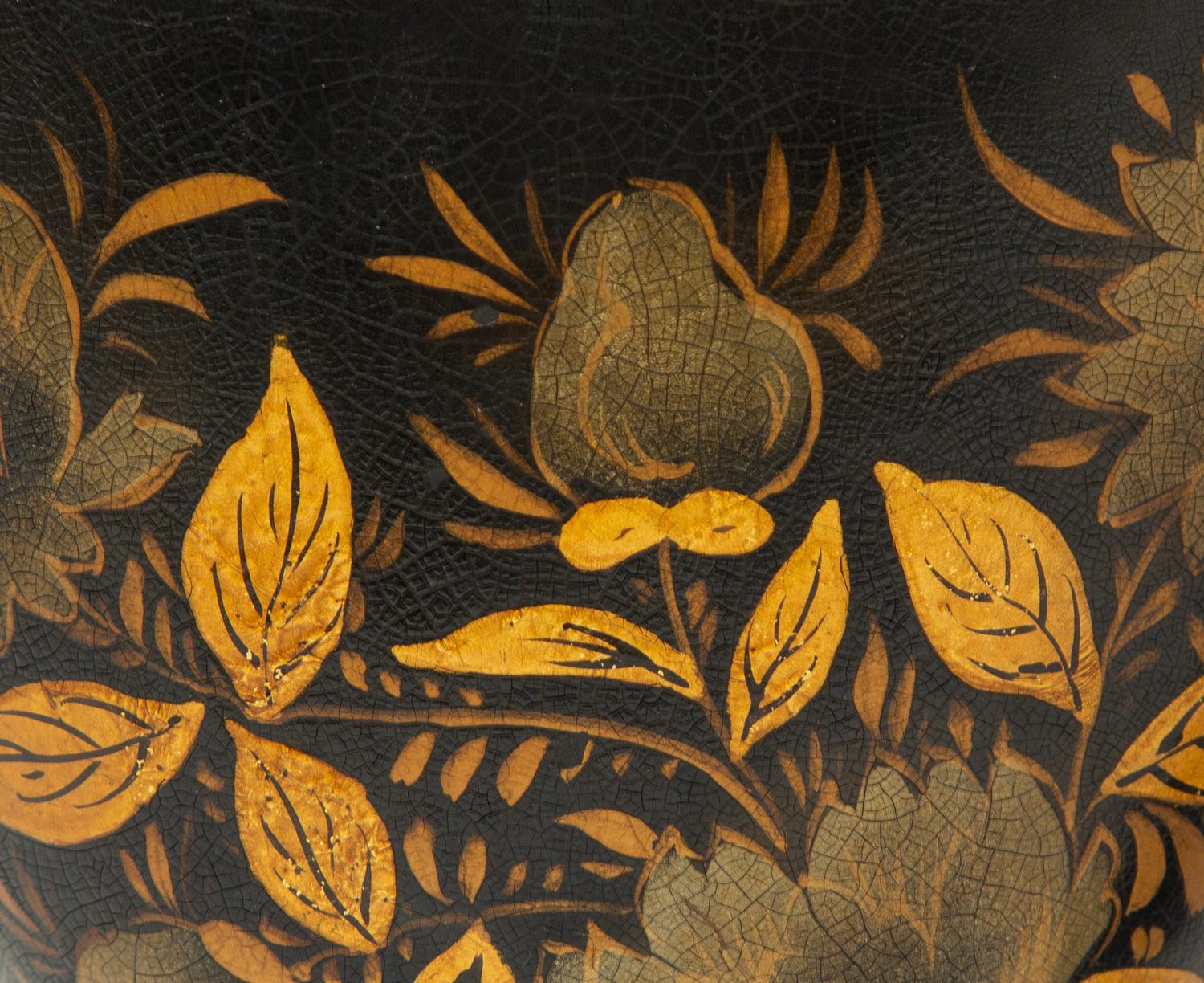 A Pair of Regency Style Black and Gilt Decorated Tole Covered Urns