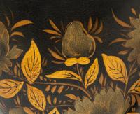 A Pair of Regency Style Black and Gilt Decorated Tole Covered Urns