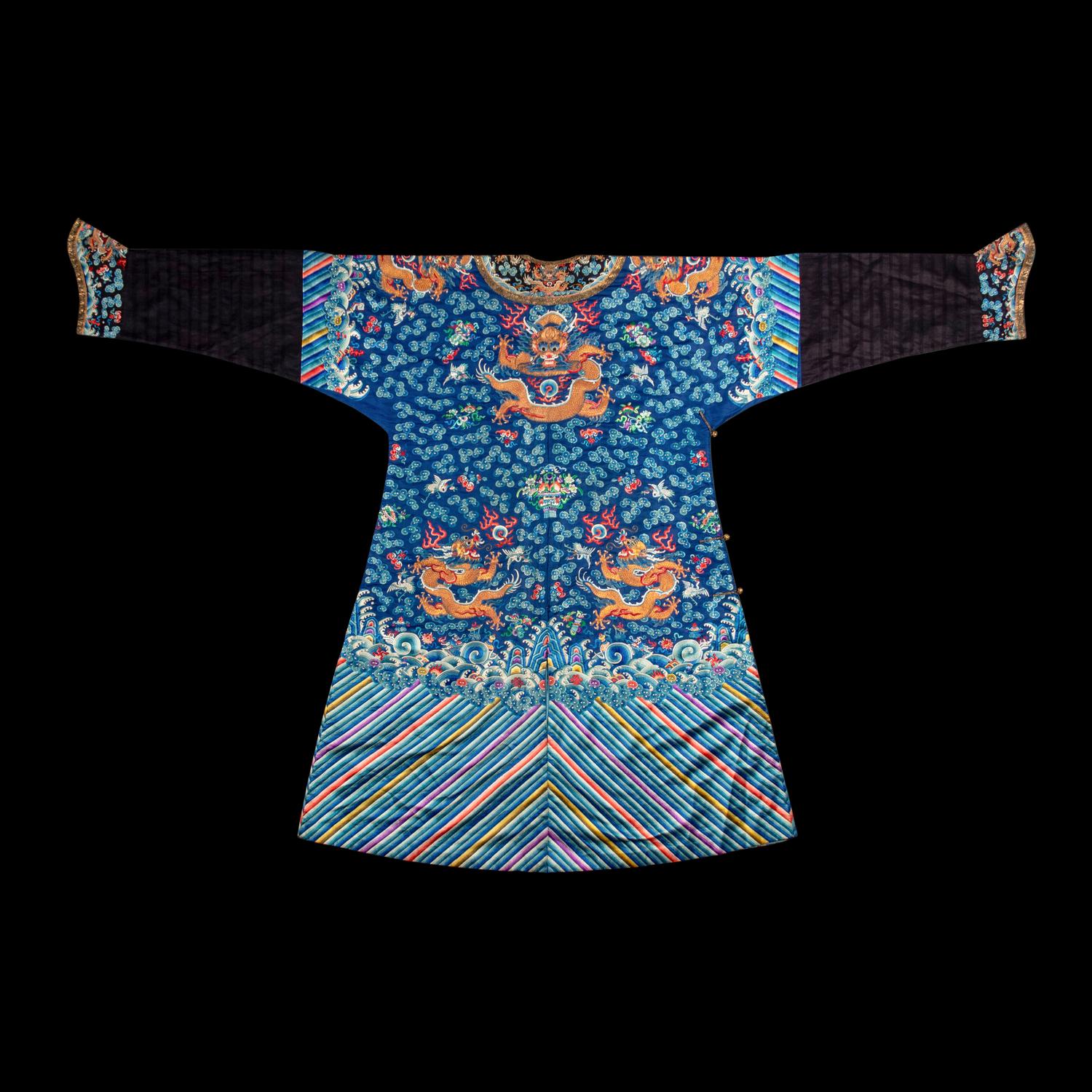 A Chinese Blue Ground Embroidered Silk Dragon Robe, Jifu, Late 19th Century 清晚期 藍緞地綉云龍紋吉服