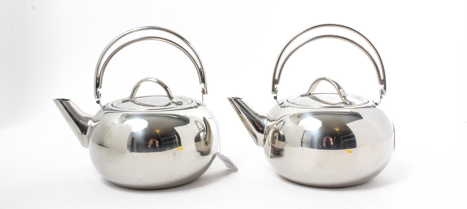 A Pair of Stainless Steel Kettles Height 8 3/4 x width 9 1/2 inches. — REVERE