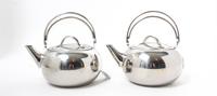 A Pair of Stainless Steel Kettles Height 8 3/4 x width 9 1/2 inches. — REVERE