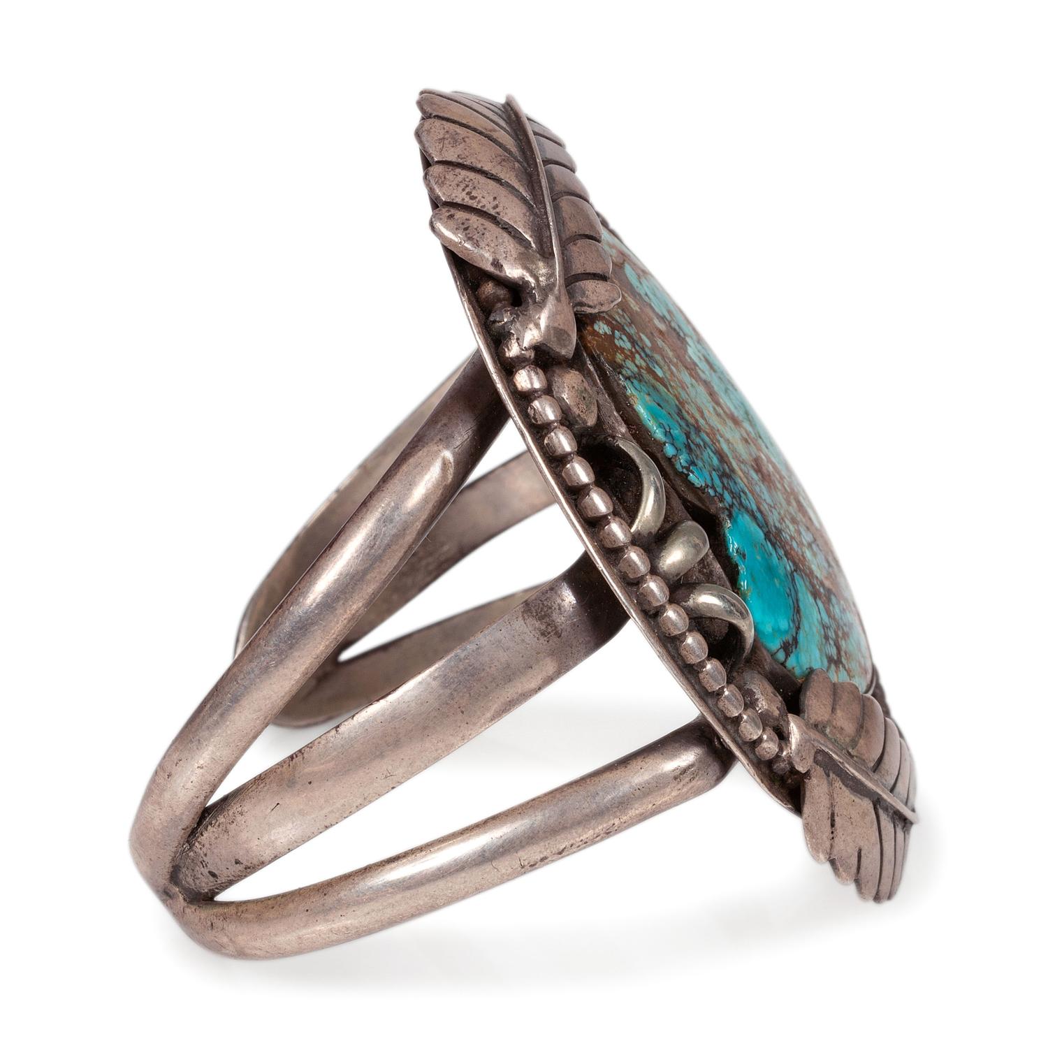 A Navajo Sterling Silver and Turquoise Cuff Bracelet, with Silver Leaf Applique