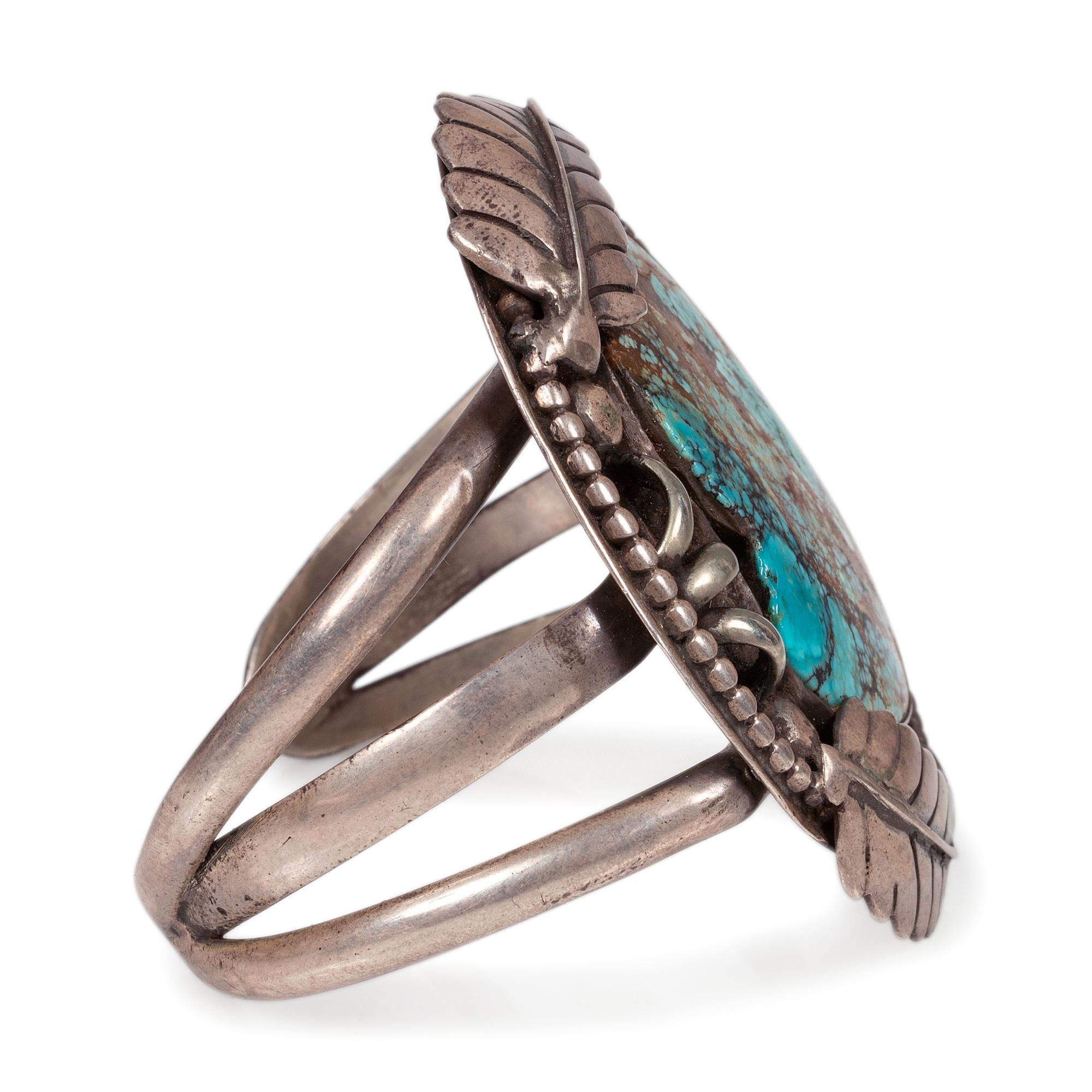 A Navajo Sterling Silver and Turquoise Cuff Bracelet, with Silver Leaf Applique