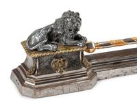 A Continental Steel and Gilt Bronze Fire Fender