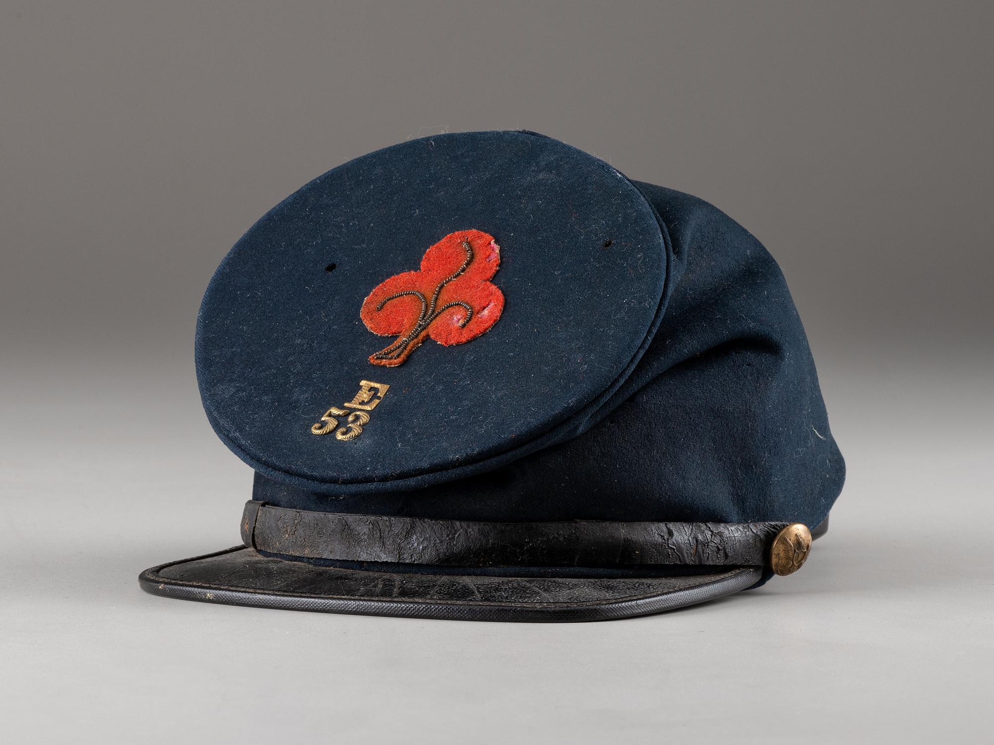 [CIVIL WAR]. 53rd Pennsylvania forage cap with insignia and II Corps, 1st Division badge.