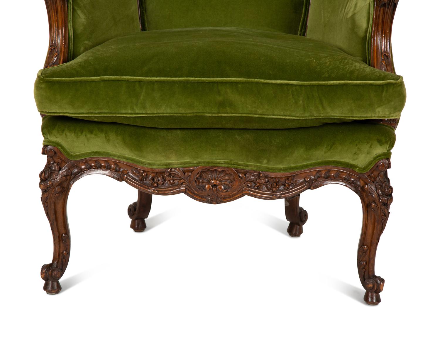 A Louis XV Style Carved Fruitwood Bergère à Oreilles
