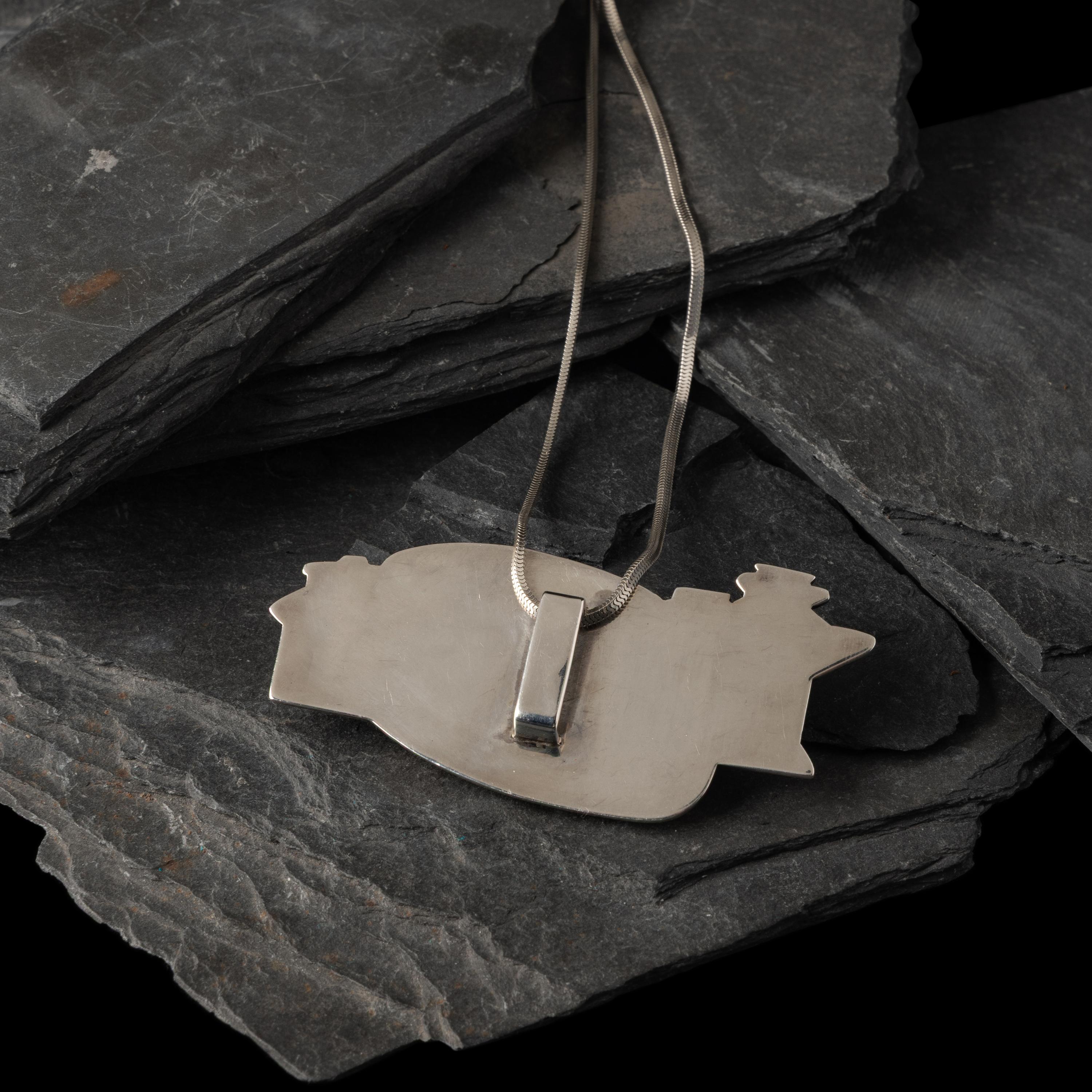 Gail Bird and Yazzie Johnson (Kewa-Laguna, b. 1949) / (Diné, b. 1946) — Figural Pendant with Multi-stone Inlay, Repurposed from the Belt in Lot 175