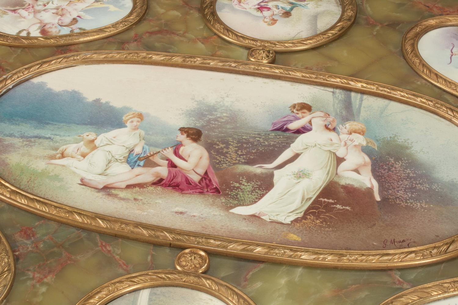 A Napoleon III Gilt Bronze Mounted Onyx and Porcelain Plaque-Inset Table