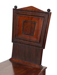 A Pair of William IV Carved Mahogany Hall Chairs