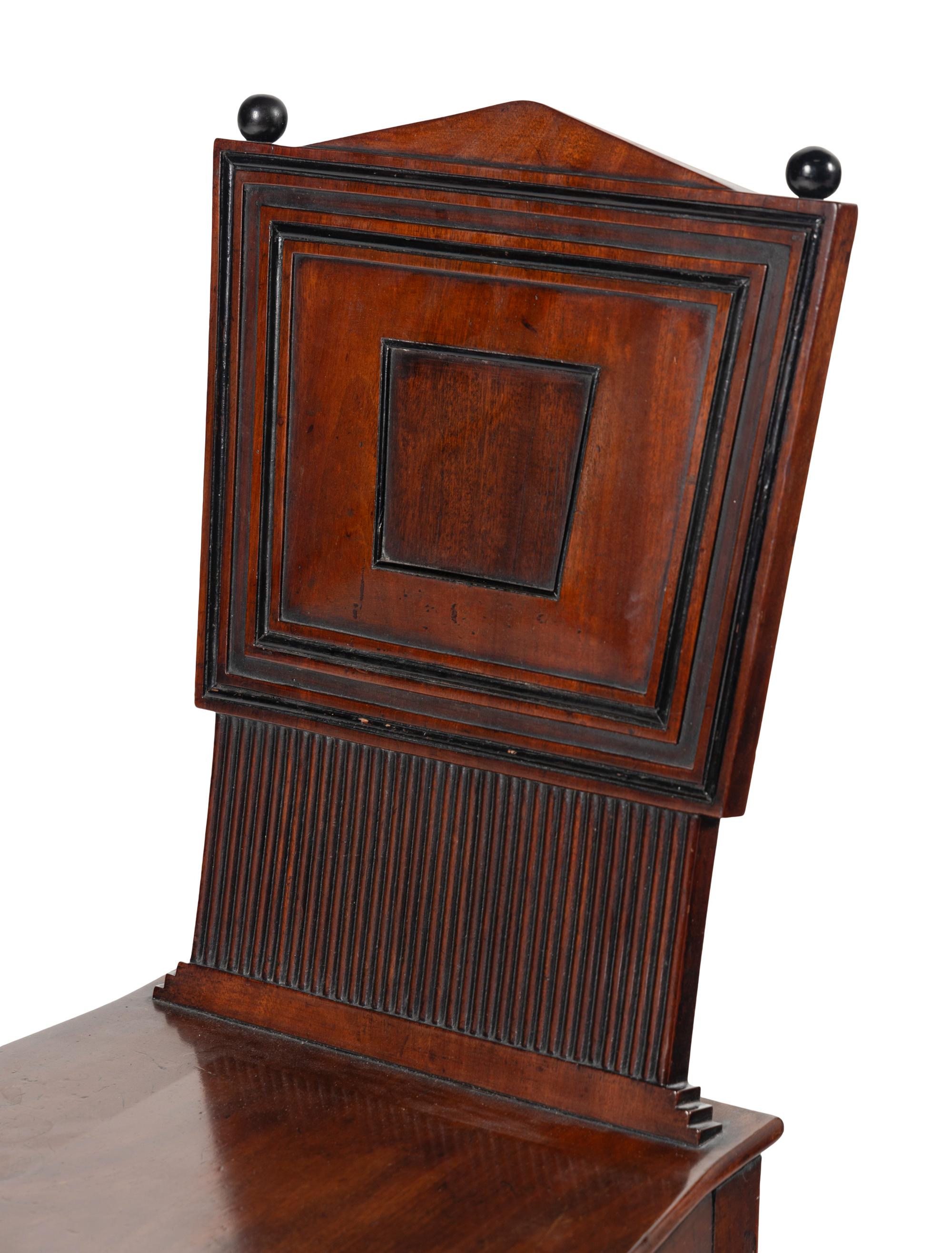 A Pair of William IV Carved Mahogany Hall Chairs