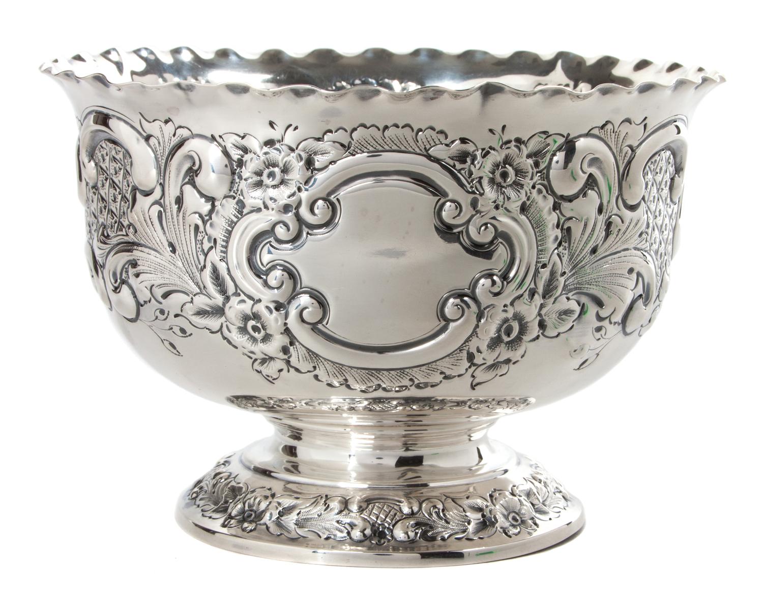 An English Silver Circular Footed Bowl, Goldsmiths and Sliversmiths, Co., London, 1920, the sides worked to show floral decoration.