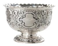 An English Silver Circular Footed Bowl, Goldsmiths and Sliversmiths, Co., London, 1920, the sides worked to show floral decoration.