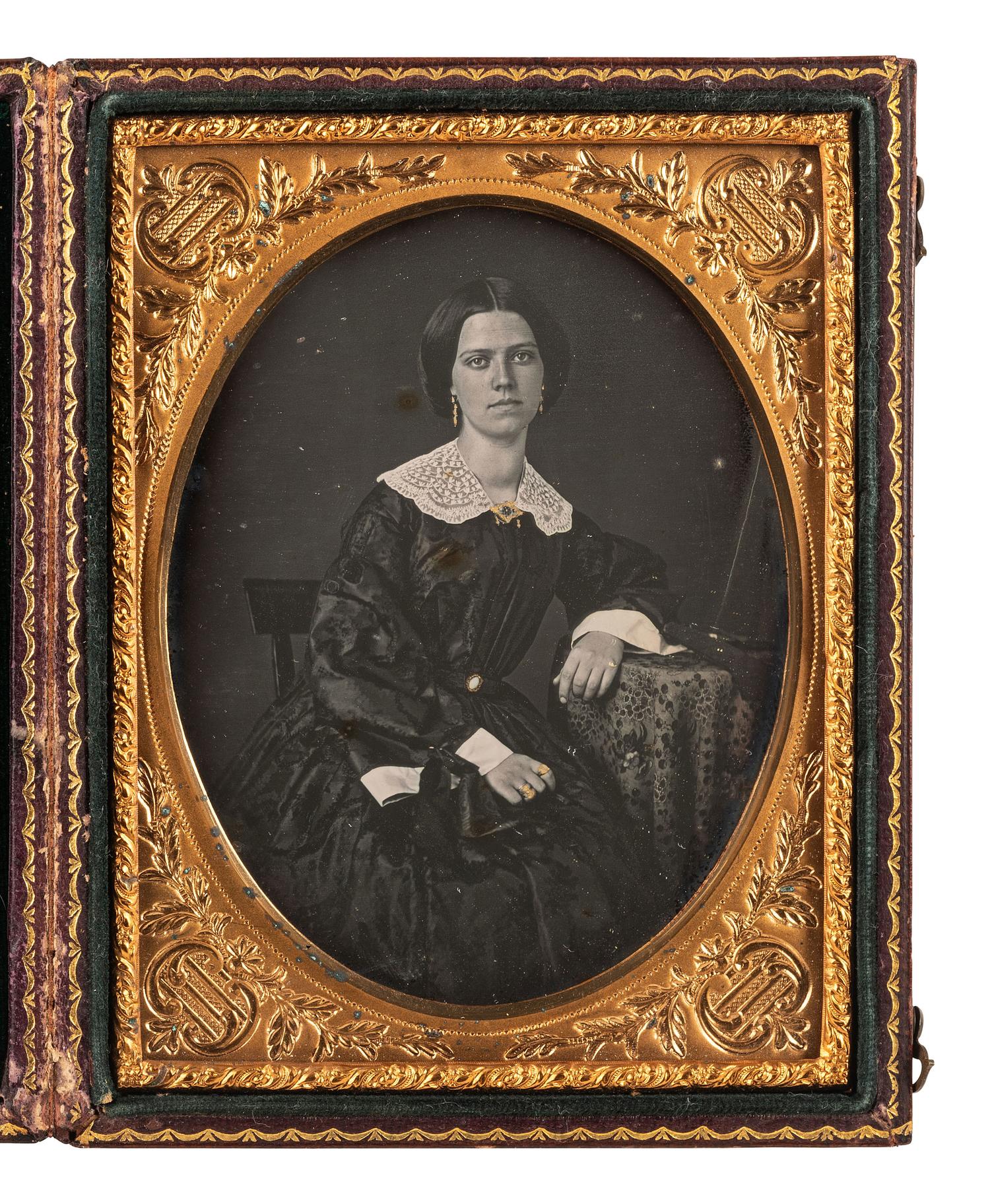 [EARLY PHOT.]. 2 daguerreotypes of attractive subjects, incl. father with children & young woman.