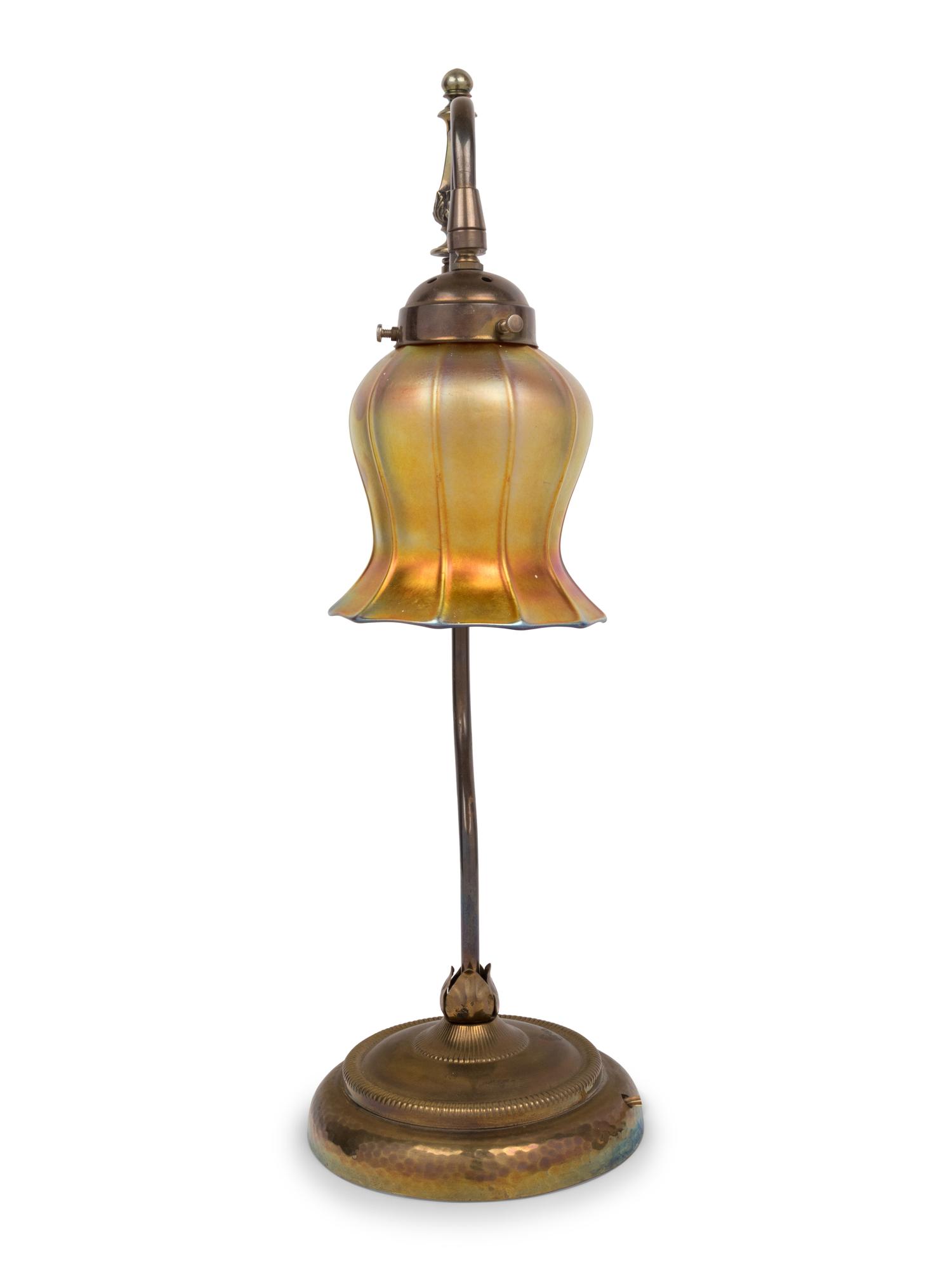 A Brass Table Lamp With Quezal Iridescent Glass Shade