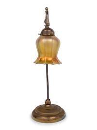 A Brass Table Lamp With Quezal Iridescent Glass Shade