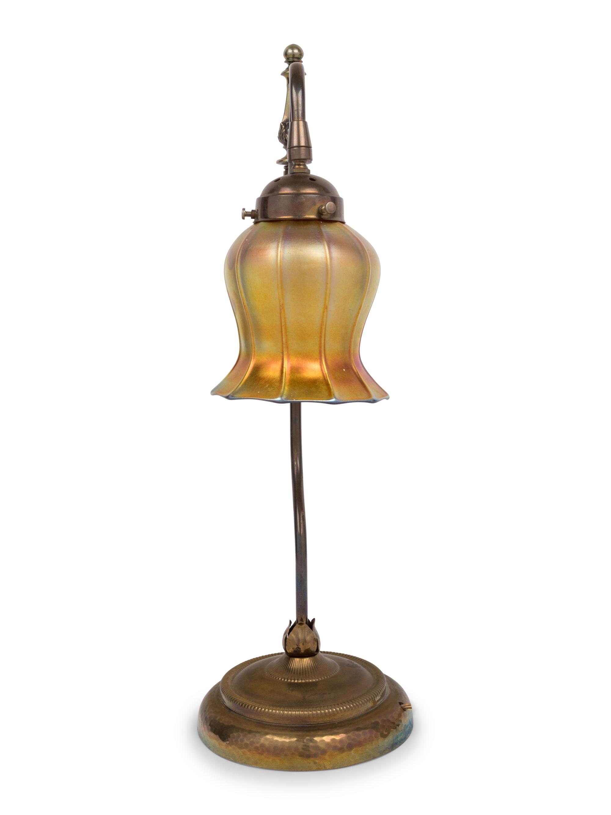 A Brass Table Lamp With Quezal Iridescent Glass Shade