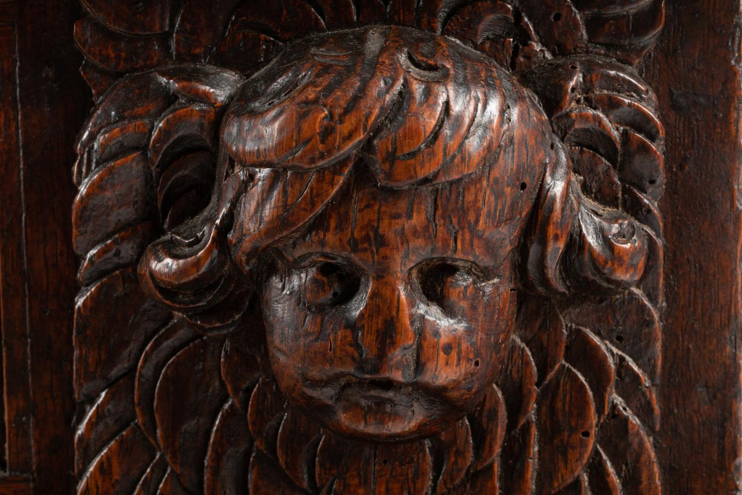 An Italian Carved Oak and Walnut Cassone