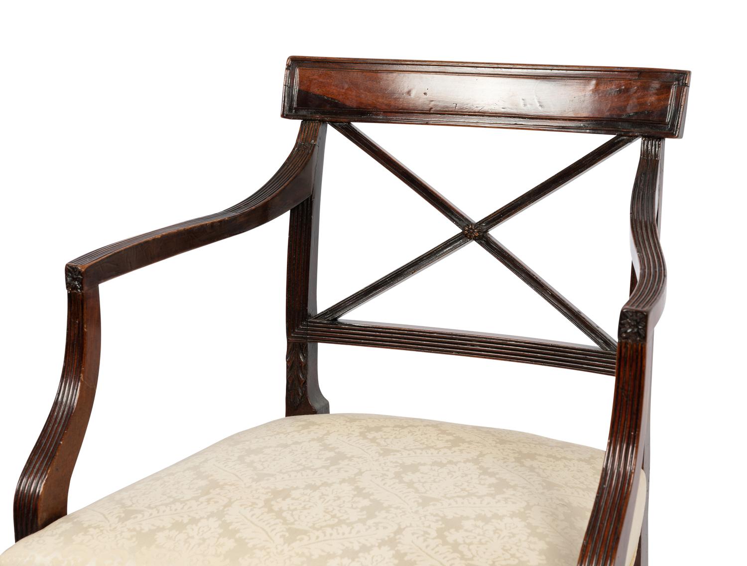 A Set of Six Regency Style Mahogany Dining Chairs and Two Armchairs